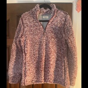 Weatherproof maroon colored super soft Sherpa pull over jacket